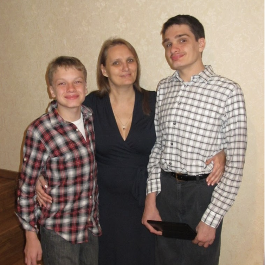 Daniel and Alexander stand with their mother Julia