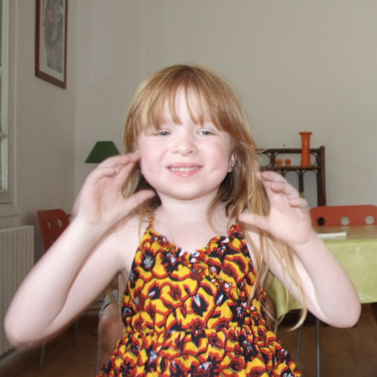 Hermance smiles at camera