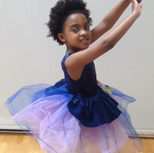 Makeda dances in a purple tutu