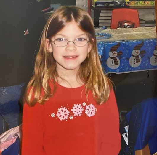 Sydney smiles at the camera 